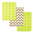 Three knit swaddles featuring avocado-themed patterns: smiling avocados, bananas, and green designs.