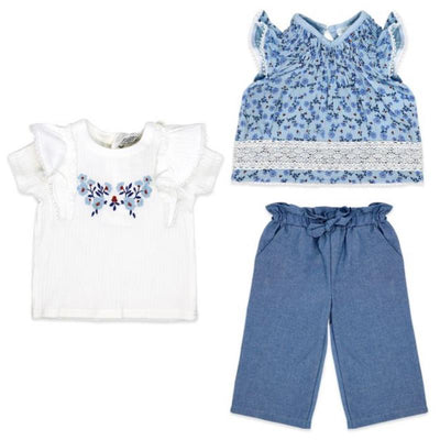 Three-piece baby girl pant set featuring a white ruffled top with floral embroidery, a blue floral top, and denim trousers.