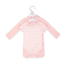 Four-piece baby girl set in pink, featuring a striped bodysuit and a long-sleeve onesie on hangers.