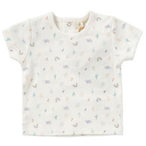 Organic baby boy’s dungaree set featuring a cream top with colorful patterns of rainbows, cacti, and abstract shapes.