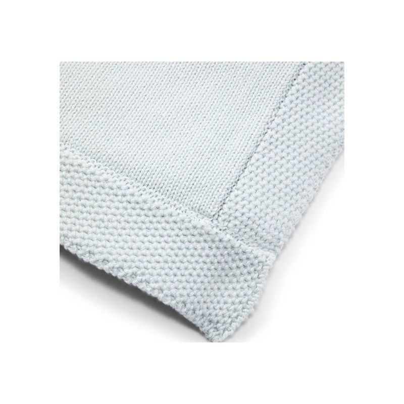 Knit blanket in soft blue color featuring a textured border, ideal for warmth and decorative use.