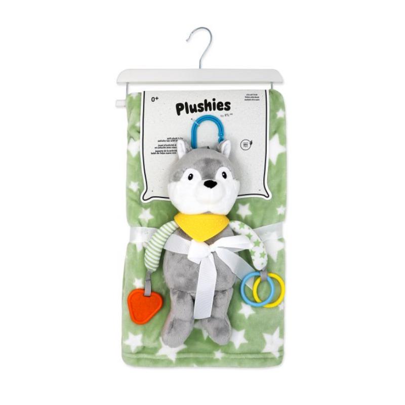 Plush sage wolf activity toy with attached rings and red heart, displayed on a soft green star-patterned blanket.