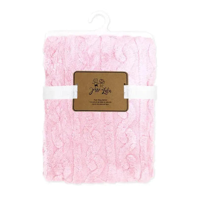 Sculpted Sherpa blanket in pink by Rose Textiles, featuring a textured design and a brown label with brand name.