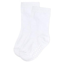 Small white socks with non-slip dots on the soles, designed for comfort and stability. Suitable for everyday wear.