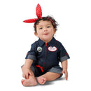 Toddler wearing a denim Rosie the Riveter costume with a red polka dot headband, displaying a cheerful expression.