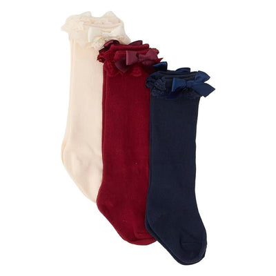 Knee high socks in dark navy, ivory, and dark cherry, featuring lace ruffles and bows at the top.
