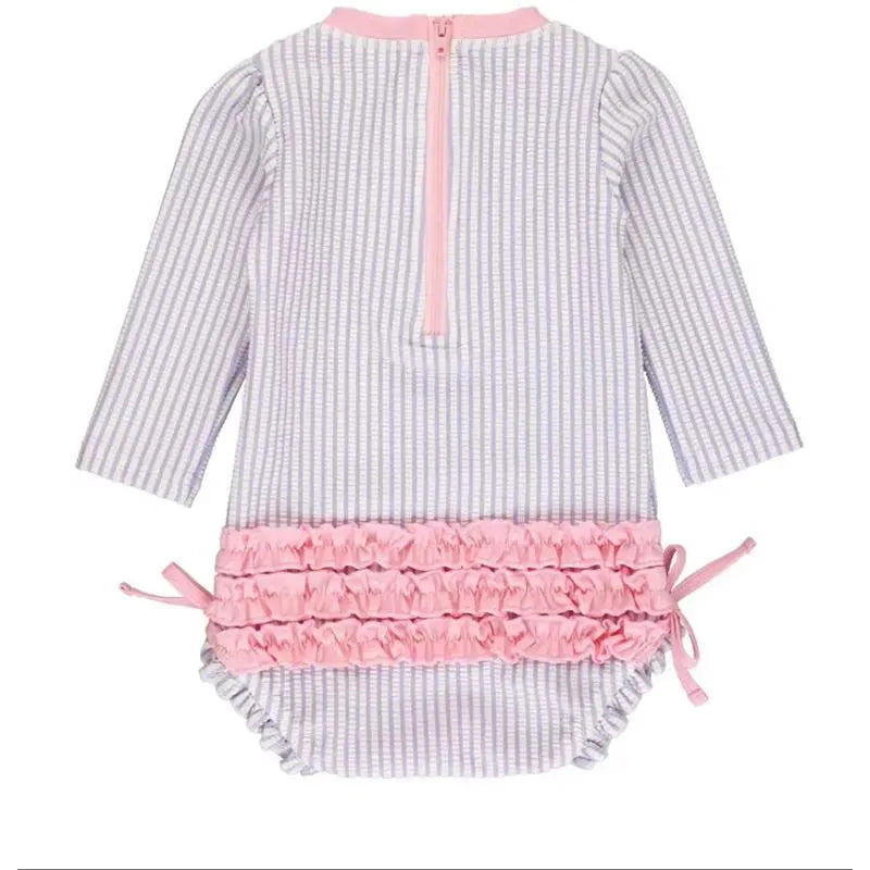 Lavender seersucker long sleeve one-piece rash guard for baby girls, featuring pink ruffle trim and back zipper closure.
