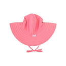Baby pink sun hat with wide brim and drawstring, designed for sun protection, featuring the Rufflebutts label.