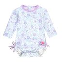 Long sleeve one-piece rash guard for babies, featuring a pastel floral pattern and tie details at the sides.