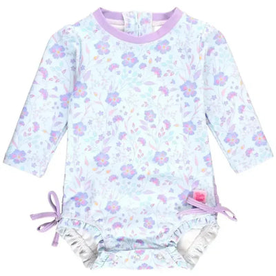 Rufflebutts Fairytale Garden long sleeve one-piece rash guard featuring a pastel floral design and purple accents.