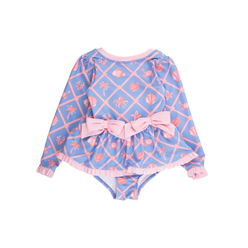 Long sleeve, peplum-style swimsuit for girls featuring a tropical print with pink accents and bows.