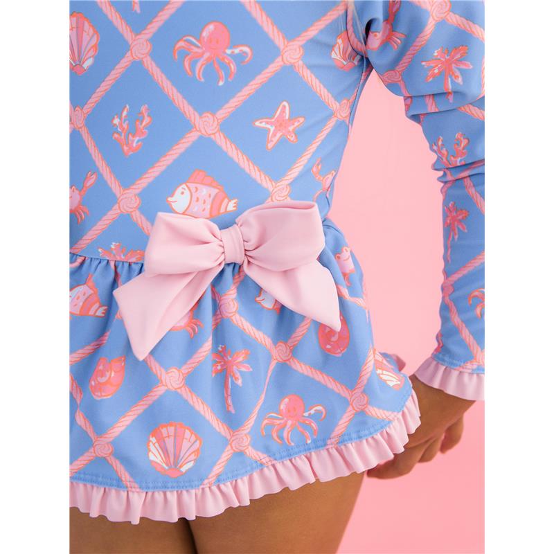 Rufflebutts tropical print long sleeve one-piece swimsuit features a pink bow peplum and sea creature designs on a blue background.