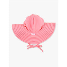Kids swim hat in bubblegum pink with a wide brim, adjustable chin strap, and a logo label on the front.