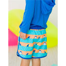 Boys swim trunks featuring a dolphin hem design in vibrant orange and blue with shark fins, paired with a blue long-sleeve shirt.