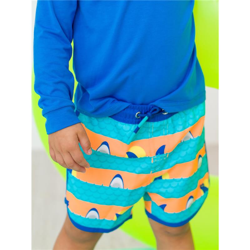 Boys swim trunks with dolphin hem, featuring a colorful shark pattern and elastic waistband for sun protection.