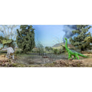 Brachiosaurus dinosaur figurines in a natural setting, featuring a gray and a green dinosaur surrounded by foliage.