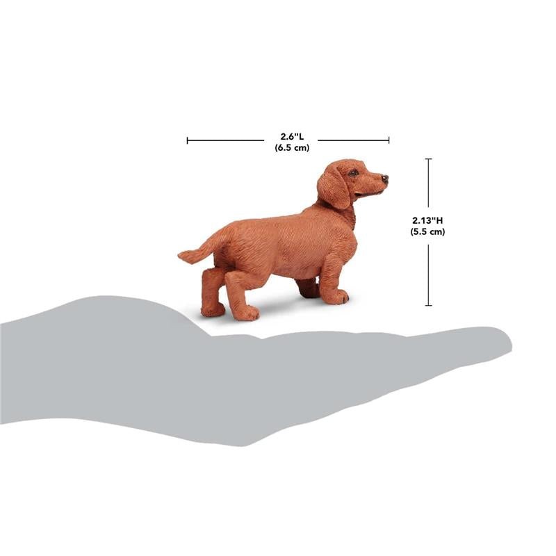 Dachshund figurine in a standing pose, made of plastic, measuring 2.6 inches long and 2.13 inches high.
