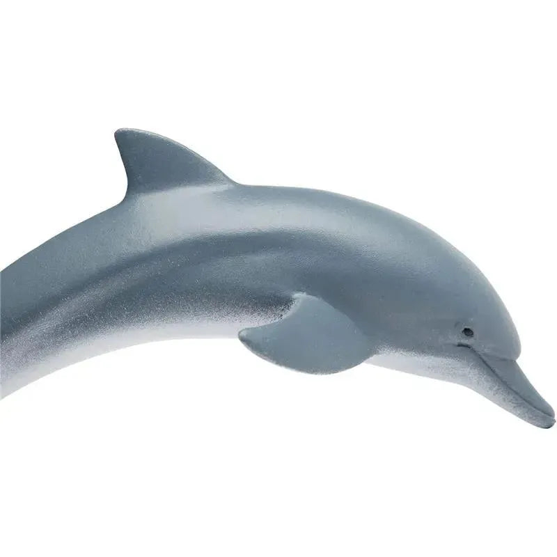Lifelike gray dolphin figurine, 4.5 inches long, showcasing detailed features and a smooth surface.
