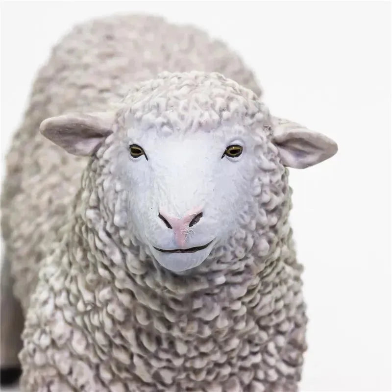 Lifelike 3.25-inch sheep figurine by Safari Ltd., featuring detailed wool texture and a friendly expression.