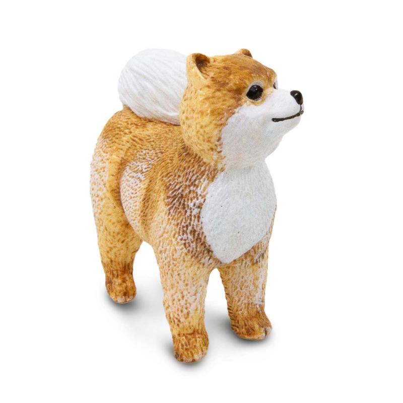 Realistic standing Pomeranian dog figure with a fluffy tail, detailed fur texture, and expressive face.
