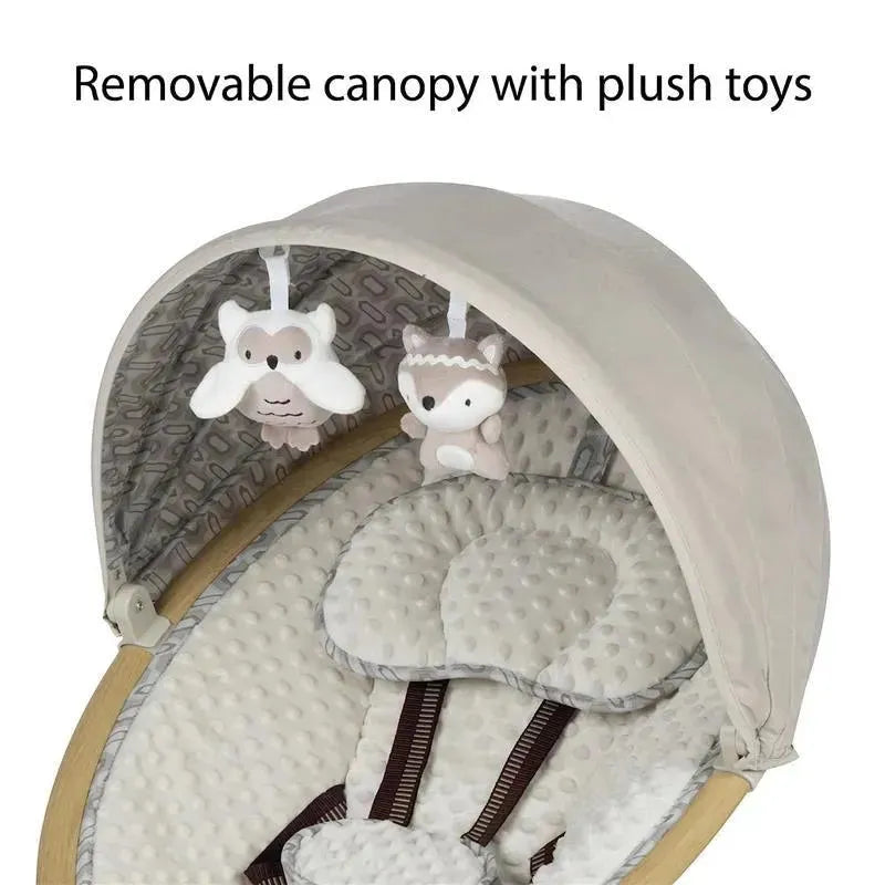 Removable canopy with plush owl and fox toys over a cushioned baby swing seat in beige and cream colors.