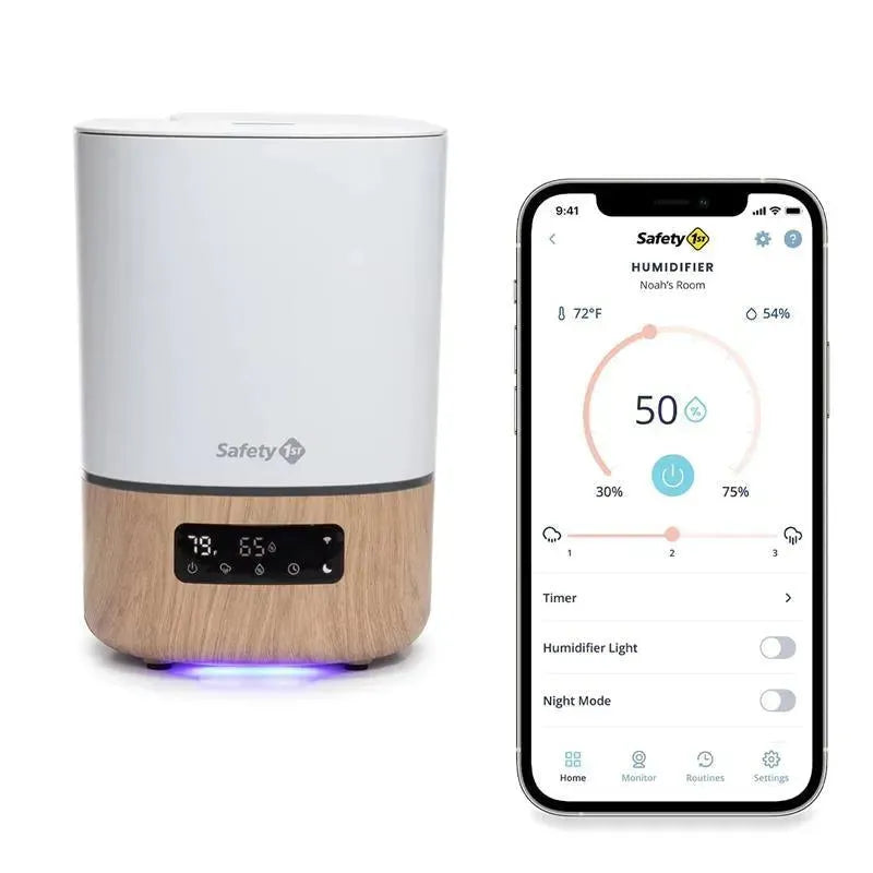 Smart humidifier by Safety 1st with a natural wood base, shown alongside a smartphone app displaying humidity settings.