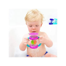 Toddler in a bathtub holding the Sassy Double Dip Funnel toy, featuring colorful spinning balls and water flowing out.