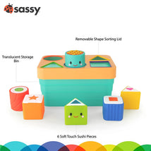 Sassy Sushi Sorter features a translucent storage bin with a removable shape-sorting lid and six soft-touch sushi pieces in various shapes.