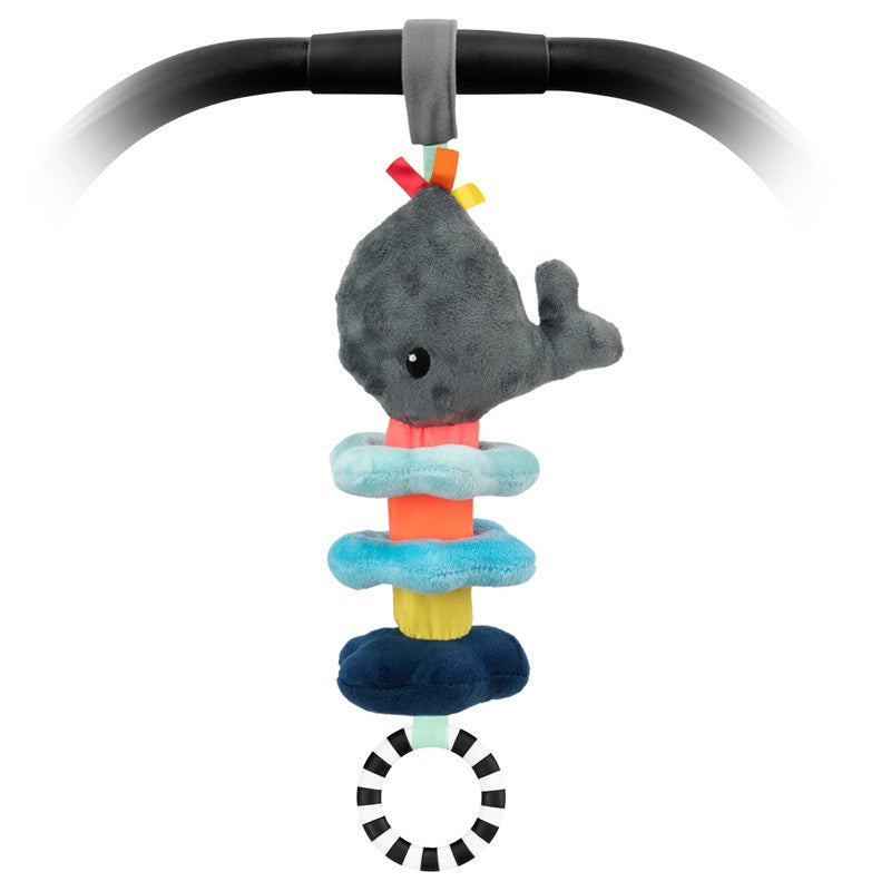 Sassy Wavy Whale Jitter toy with a gray whale plush on colorful stackable rings and a black and white striped ring below.