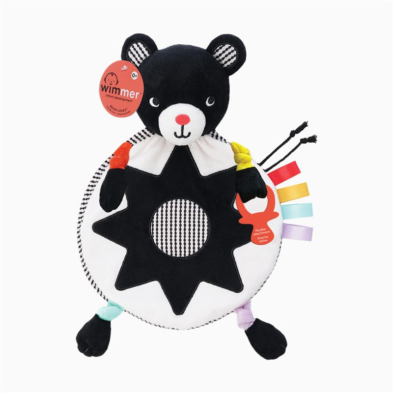 Sassy Wimmer Bear Lovey featuring a round plush bear design with colorful ribbon tags and a textured body for sensory play.