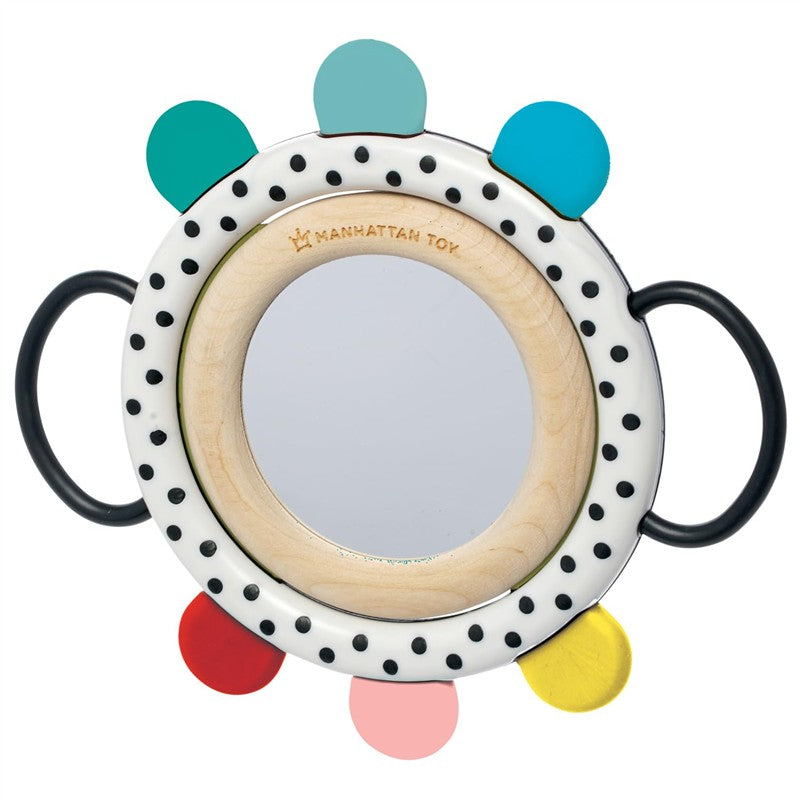 Sassy Wimmer Grasp & See Mirror with colorful handle grips, polka dots, and a central reflective surface.