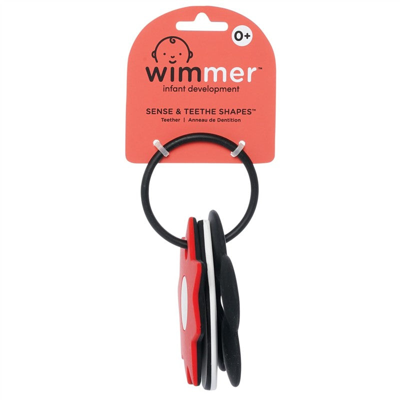 Colorful Wimmer Sense & Explore Shapes teething toy displayed on a card, featuring various shapes in red, black, and white.
