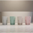 Shnuggle Ellie Bath Toy Storage Scoop in taupe, with three additional color variations displayed, on tiled floor.