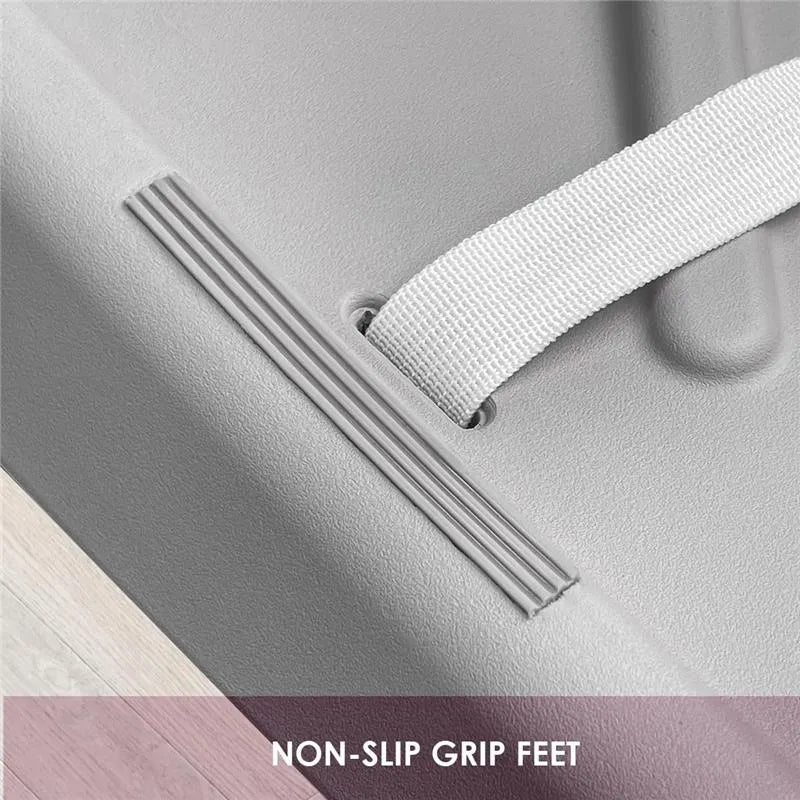 Grey Shnuggle squishy baby changing diaper pad featuring non-slip grip feet and a safety strap.