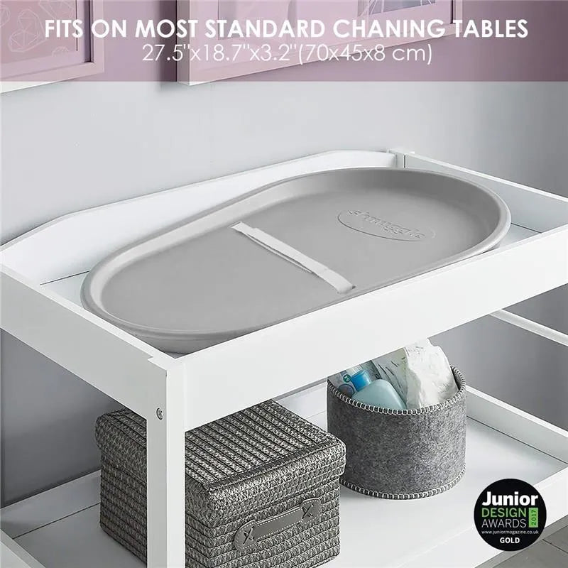 Taupe Shnuggle squishy baby changing pad on a white changing table, designed to fit most standard tables.