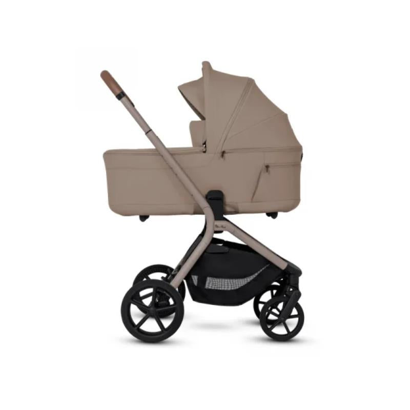 Silver Cross Breez Compact Stroller with a Champagne folding bassinet, featuring a sleek design and four wheels.
