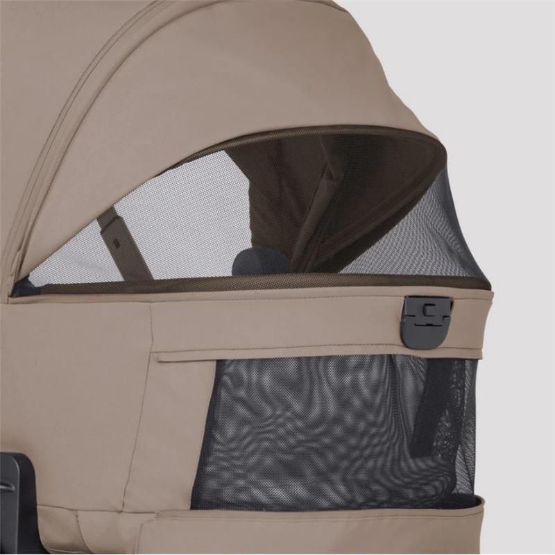 Champagne-colored canopy of the Silver Cross Breez stroller showing a mesh window and zippered storage pocket.