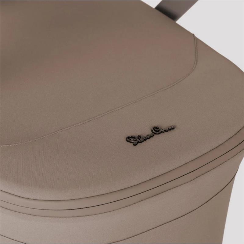 Silver Cross Breez stroller seat in champagne color, featuring smooth fabric and embossed logo detailing.