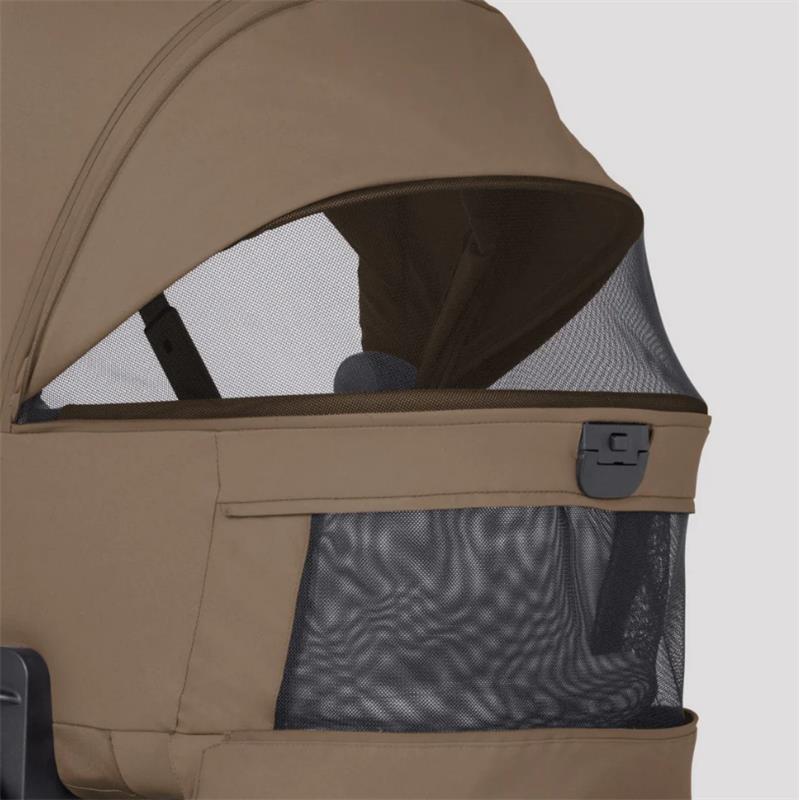 Modular bassinet with a mesh window, part of the Silver Cross Breez Stroller & Bassinet Bundle in Maple color.
