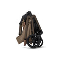 Silver Cross Breez Modular Stroller in a folded position, featuring a sleek design and brown accents.