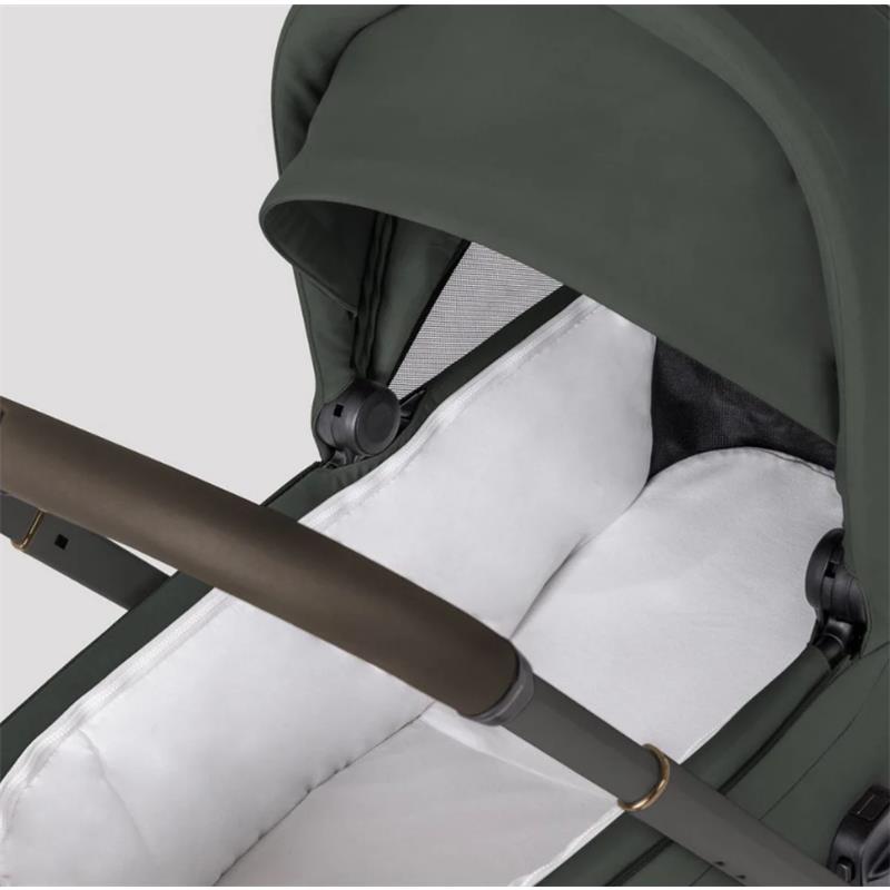 Silver Cross Breez Modular Stroller & Bassinet Bundle in pewter with a plush white interior and adjustable canopy.
