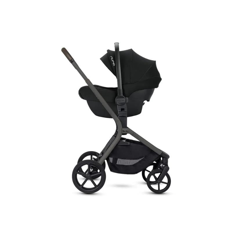 Silver Cross Breez modular stroller with bassinet in pewter, featuring a sleek frame, adjustable handle, and large wheels.