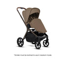 Silver Cross Breez Modular Stroller in Maple color, featuring a reclined seat for newborn mode and spacious storage basket.