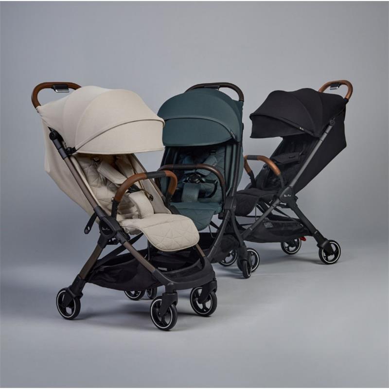 Lightweight Silver Cross Clic strollers in beige, green, and black with adjustable canopies and wooden handles.