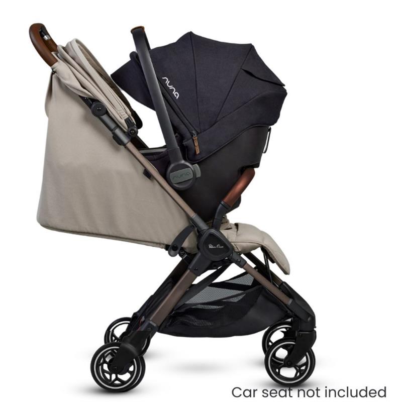 Lightweight Silver Cross Clic stroller in Latte color, featuring a dark canopy, leather handle, and mesh storage below.