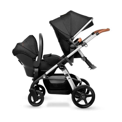 Silver Cross Coast/Wave Lower Adapters, featuring two black car seats on a stroller frame, showcasing a stylish silver finish and wood accents.