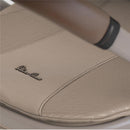 Silver Cross Cove 2 Compact Bassinet in Champagne with a textured, stylish cover and branded logo detail.