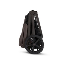 Full-sized Silver Cross Cove 2 stroller in chocolate, shown in a folded position with large black wheels.