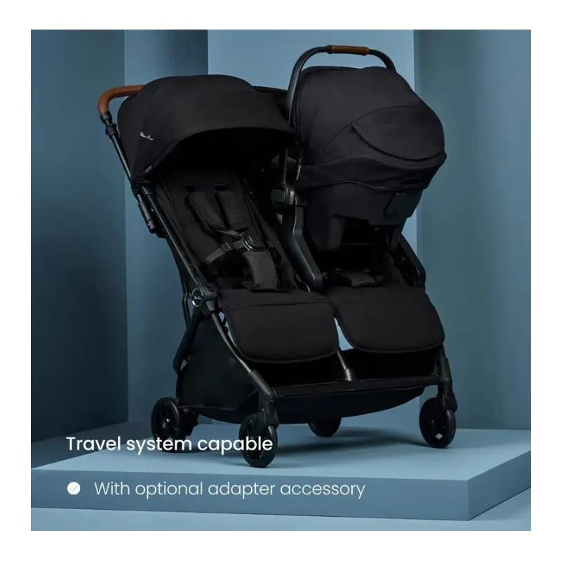 Lightweight double stroller in black with adjustable canopies, featuring a travel system capability and optional adapter accessory.