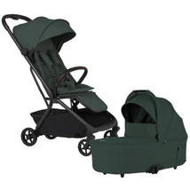 Silver Cross Nia Compact Travel Stroller and Bassinet Bundle in Conifer, featuring a dark green fabric and a sleek design.